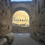 Colosseum archway with fallen column